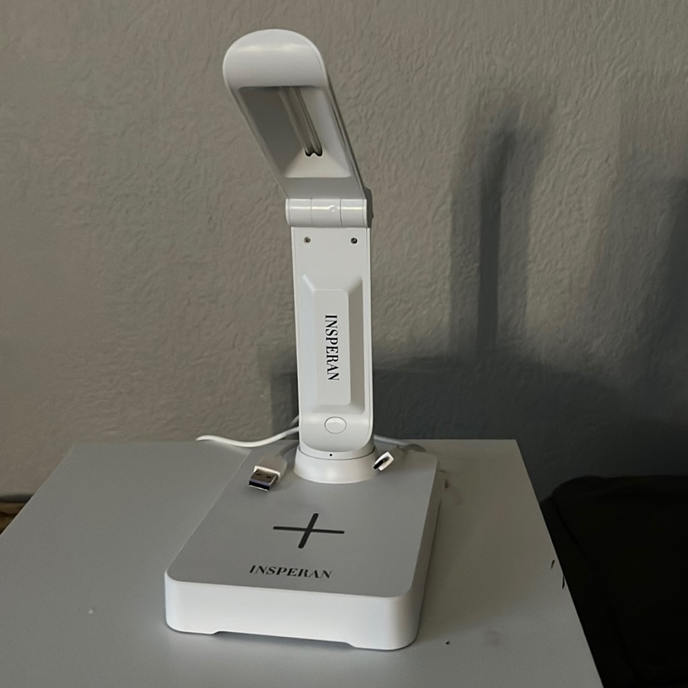 Wireless Phone charger also has a blue sanitizing light